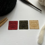 1.5” square ultrasuede tag, sleeping bear