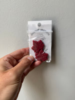 Maple leaf needle stoppers
